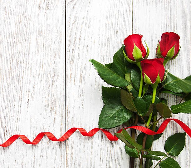 istock Roses and red ribbon 639689880