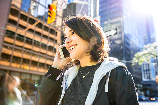 istock Young woman talking on mobile in downtown Toronto 639693532