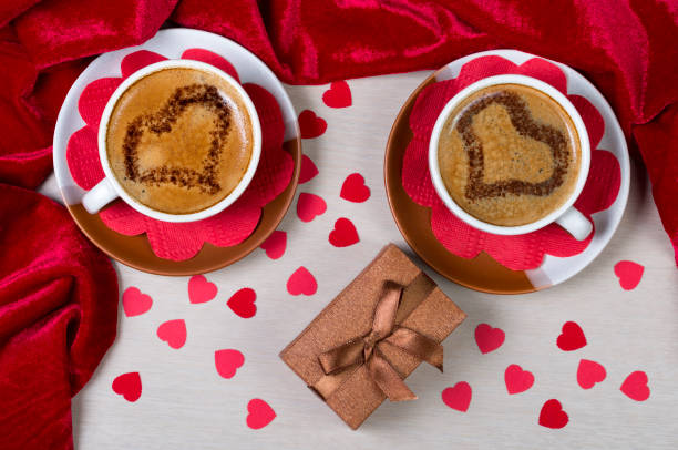 istock Two cups with coffee, gift box and paper hearts. Romantic 639695718