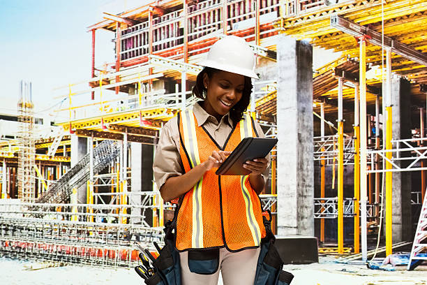 istock Smiling building contractor using tablet outdoors 639696952