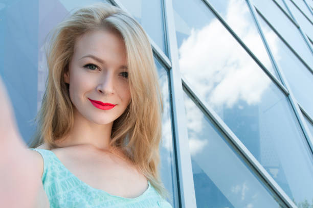 istock Young happy woman taking selfie 639697980