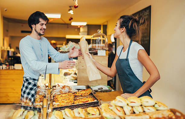 istock Young man buying bread at a bakery 639698310