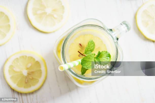 Lemonade In Jar With Green Straw Stock Photo - Download Image Now - Airtight, Backgrounds, Circle