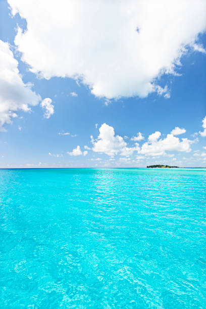 istock Blue sky and ocean including a small island 639702932