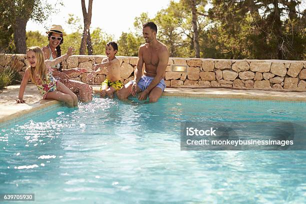 Wide Angle View Of Family On Vacation Having Fun By Stock Photo - Download Image Now