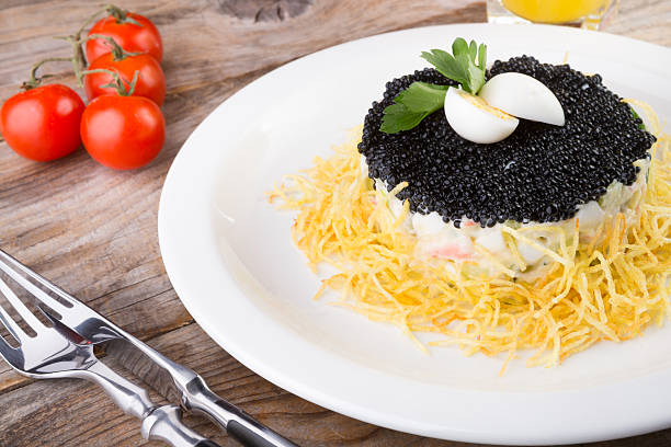istock Russian salad with black caviar 639707548