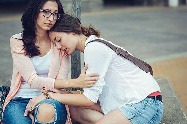 istock Crying on best friends shoulder 639707686