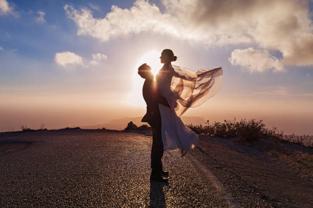 istock Wedding couple on the road, sunset light 639707918