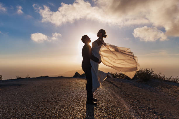 istock Wedding couple on the road, sunset light 639708006