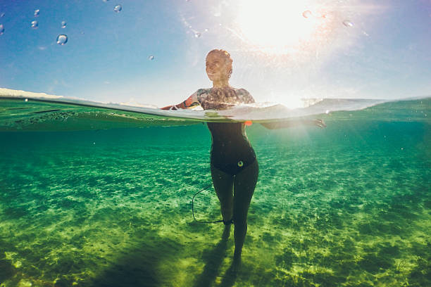 istock Surfer girl waiting for a perfect wave 639708328