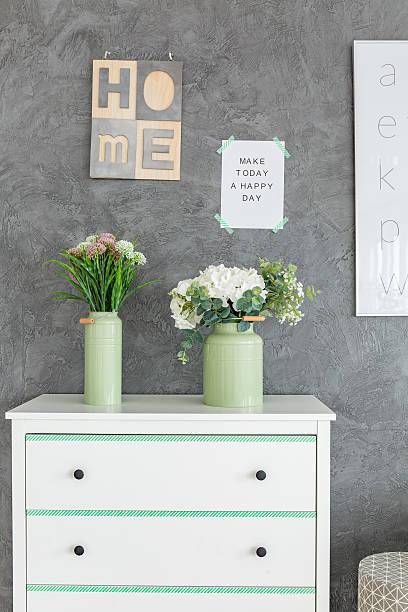 istock Chest of drawers against grey wall 639709774