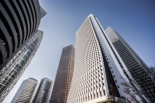Low angle view of modern skyscrapers in Shinjuku, Tokyo.