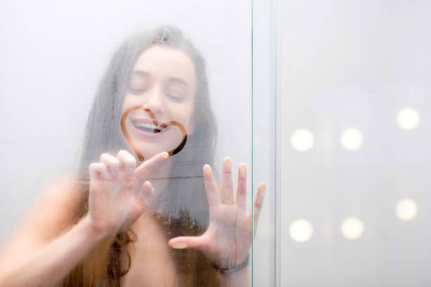 istock Young woman showering 639710112