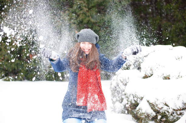 istock Smiling girl walking in a winter park and having fun 639710810