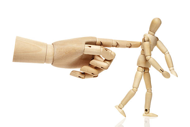 istock Wooden puppet and hand 639710870