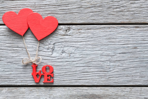 istock Valentine day background, handmade hearts on wood with copy space 639713012