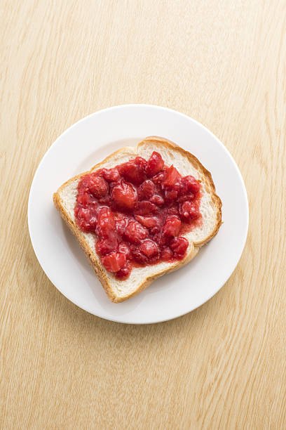 Strawberry jam painted in bread
