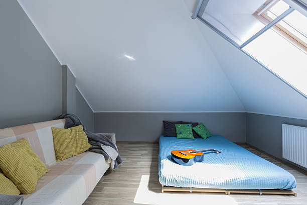 istock Attic minimalist bedroom with mattress 639716154