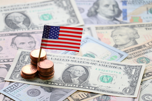 US flag and Dollar cash background, USA finance and economy concept