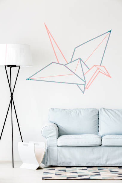 istock Creative origami crane on the wall 639717958