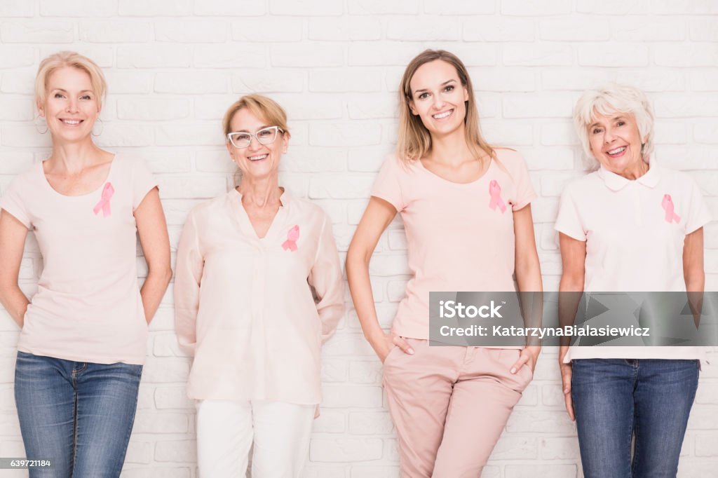 Fighting against cancer together Four positive women in different age fighting against breast cancer together Women Stock Photo