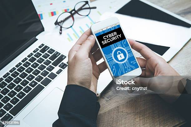 Smartphone In Hand And Showing Cyber Security Concept On Screen Stock Photo - Download Image Now