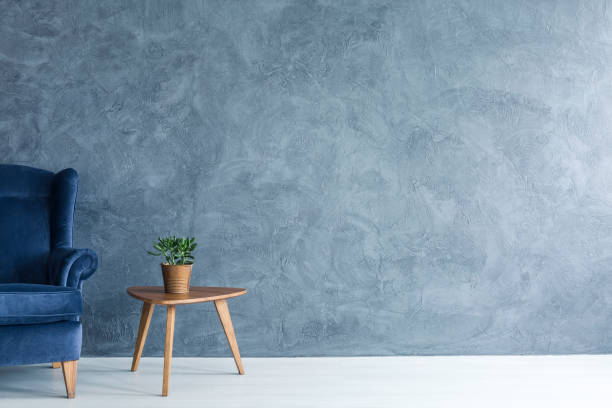 blue armchair and wood side table - side table imagens e fotografias de stock