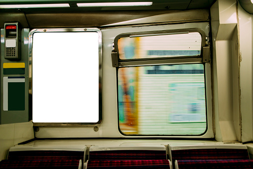A blank advertisement panel inside a subway train