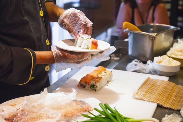 istock Making traditional Japanese sushi rolls 639724050
