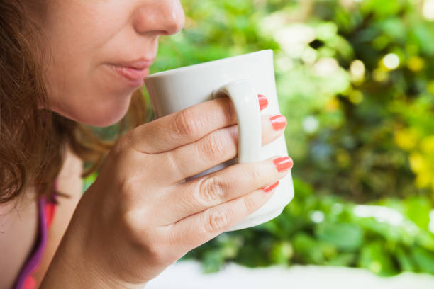 istock Caucasian woman drinks coffee 639724082