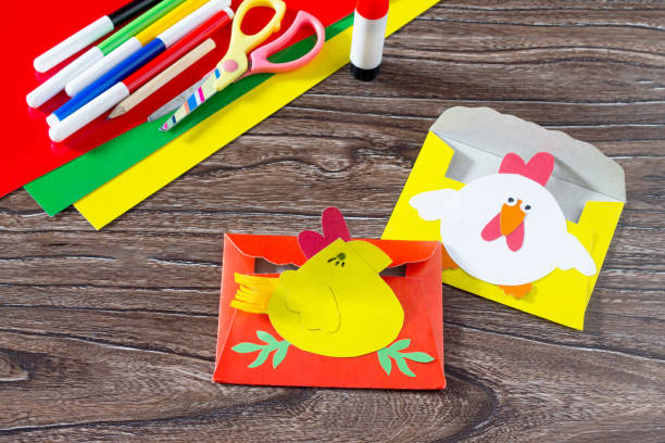 istock The child create an Easter card Cockerel. Handmade. 639725630