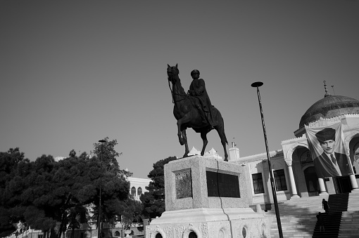 Ankara, Turkey - November 10, 2013: Founder of Turkey Ataturk statue is located at high hill in front of museum at downtown of  Ankara Turkey - black and white