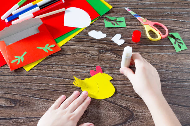 istock The child create an Easter card Cockerel. Handmade. 639727084