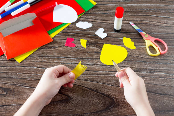 istock The child create an Easter card Cockerel. Handmade. 639727288