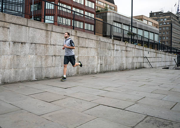 istock Man running outdoors in the city 639728210