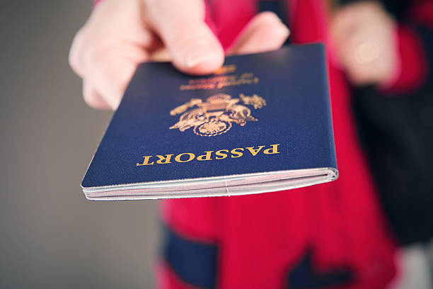 istock Traveler Holding US Passport 639730556