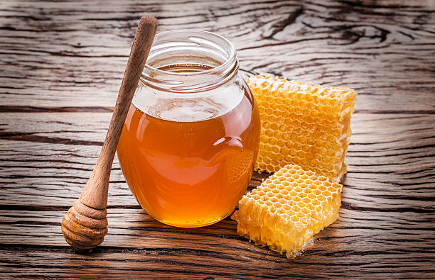 istock Jar full of fresh honey and honeycombs. 639732986