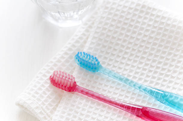 istock Pink and blue toothbrush 639734550