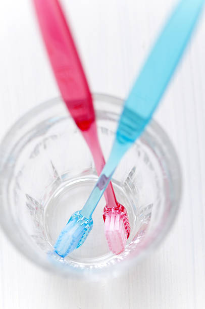 istock Pink and blue toothbrush 639734744