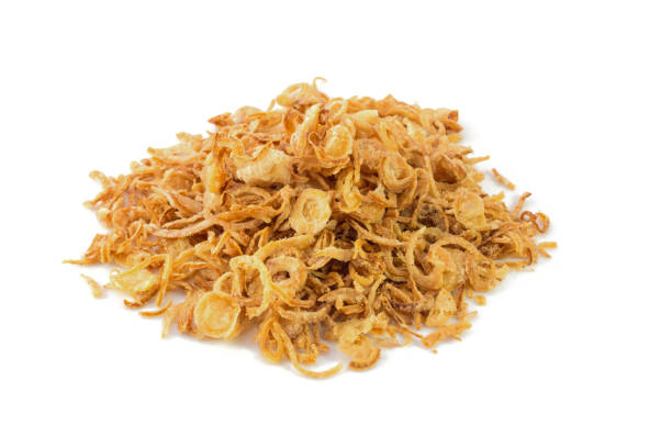 istock Fried onions or crispy fried onion flakes isolated on white 639745096