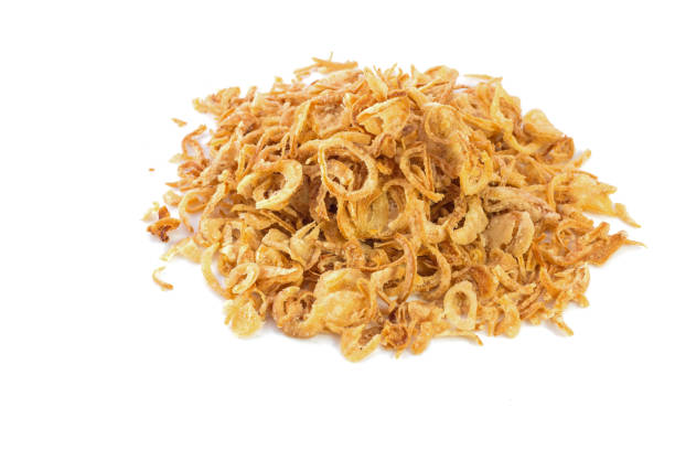 istock Fried onions or crispy fried onion flakes isolated on white 639745242