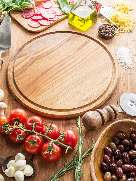 istock Pizza with mushrooms, salami and tomatoes. 639745246