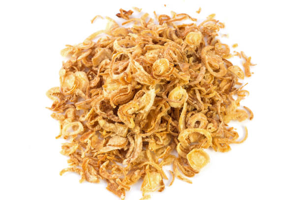 istock Fried onions or crispy fried onion flakes isolated on white 639745356