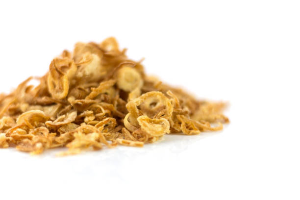 istock Fried onions or crispy fried onion flakes isolated on white 639745400