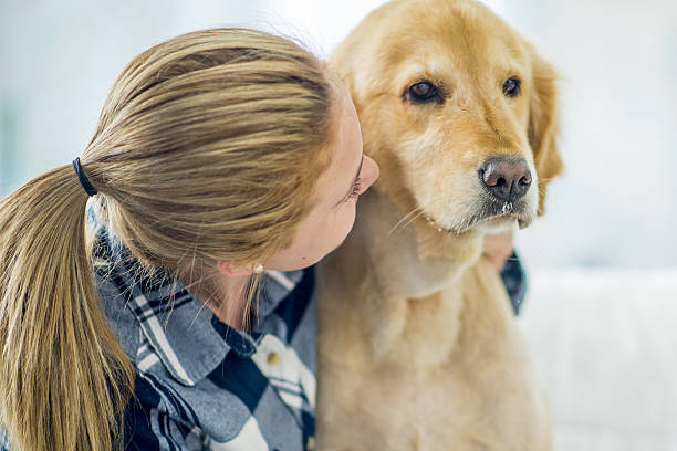 istock Young Girl with Her Dog 639745644