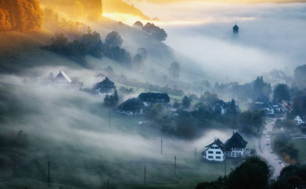 scenic historic village in germany covered in fog. - forest black forest sky night imagens e fotografias de stock