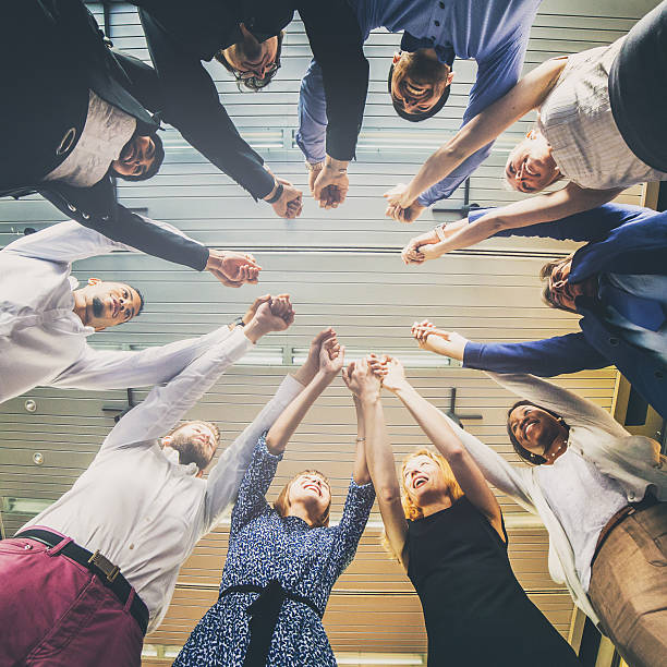istock Business people joining hands 639751256