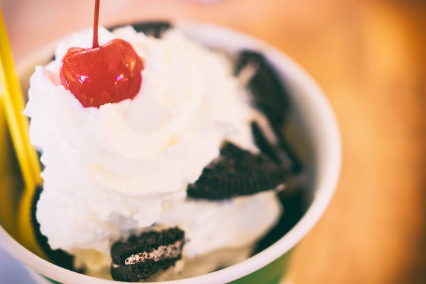 istock Cookie and cream ice cream with red cherry on top 639754684