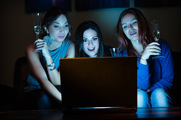 istock Three girlfriends, drunk, drinking champagne, celebrating, watch 639758956