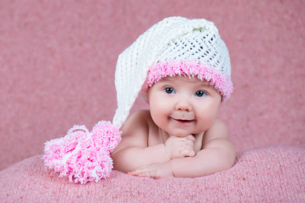 istock Newborn baby in a warm knitted hat. 639762496